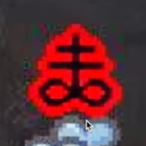 The Brimstone example input: a red symbol with black crossbars and two loops above a pedestal.