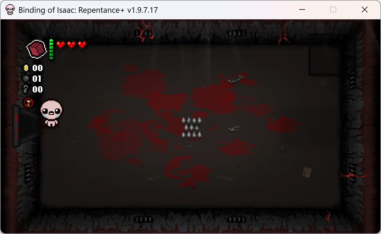 Isaac beside the left doorway, with sacrifice spikes in the middle of the room and the health HUD visible.